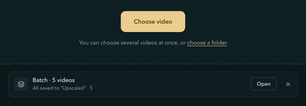 The home page after a batch: under Choose video and its line, the row Batch · 5 videos, All saved to “Upscaled” · 5, with Open